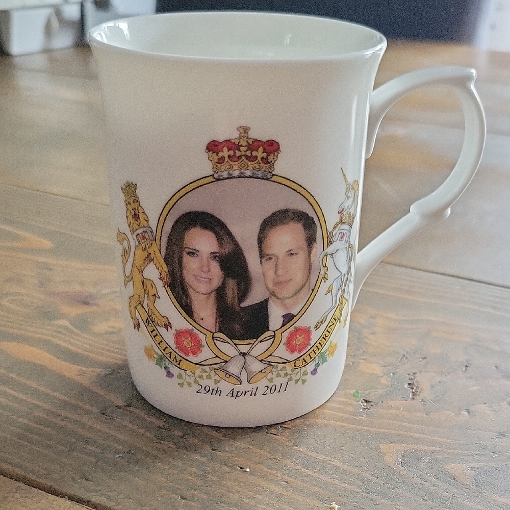 White Porcelain Mug with Gold Accents and Royal Design